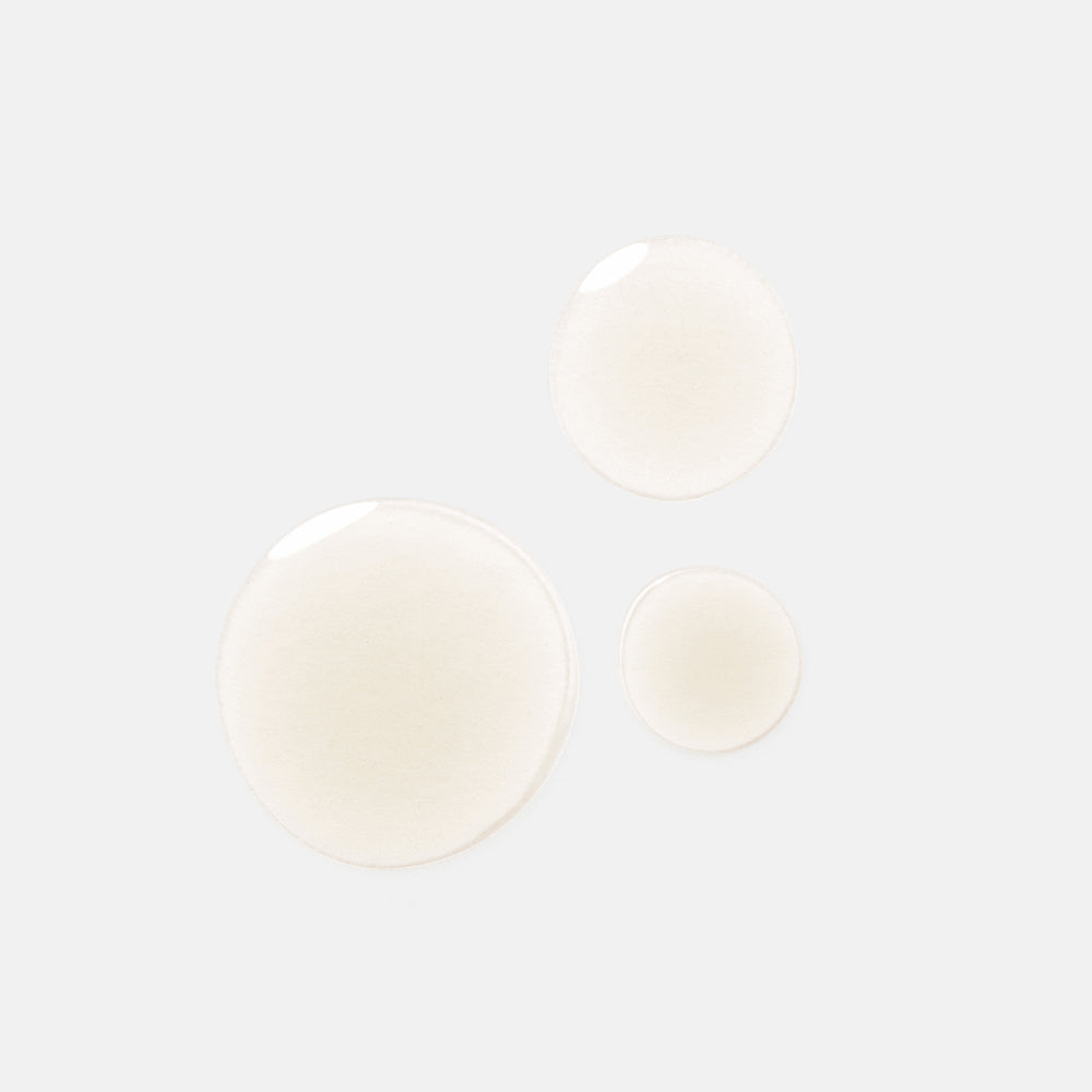 Three translucent, frosted circular discs in varying sizes on a solid light gray background.