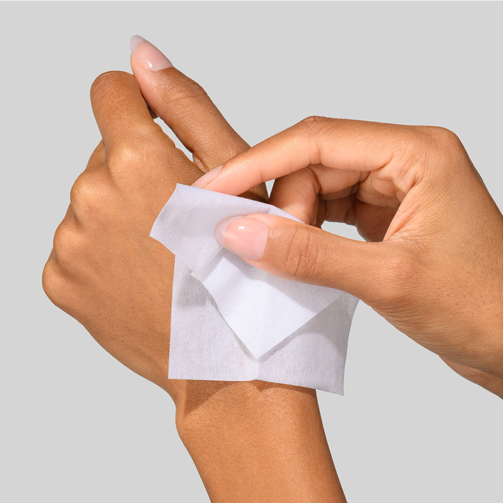 Woman applying a 5X Power Peel sachet to hand